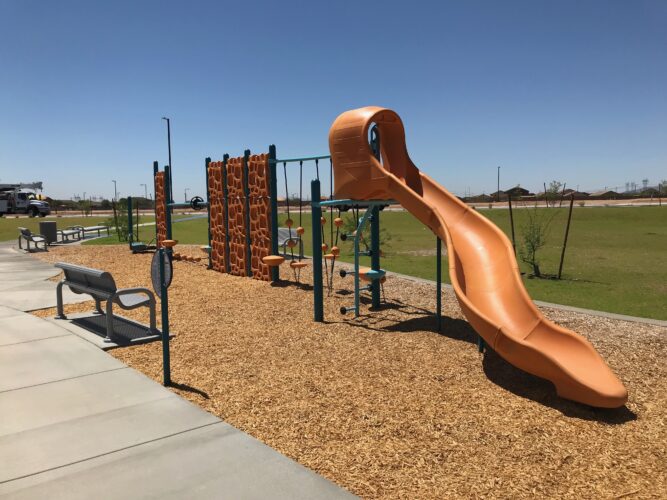 playground structure with yellow slide
