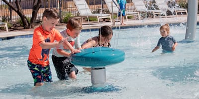 Kids playing at inclusive water park