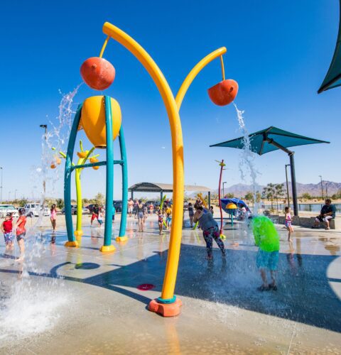 children standing underneath water at Festival Fields splash pad