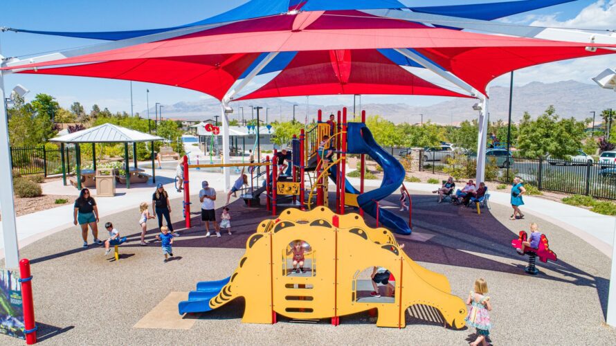 kids playing under shade structures at Alyn Beck Memorial Park in Las Vegas, NV