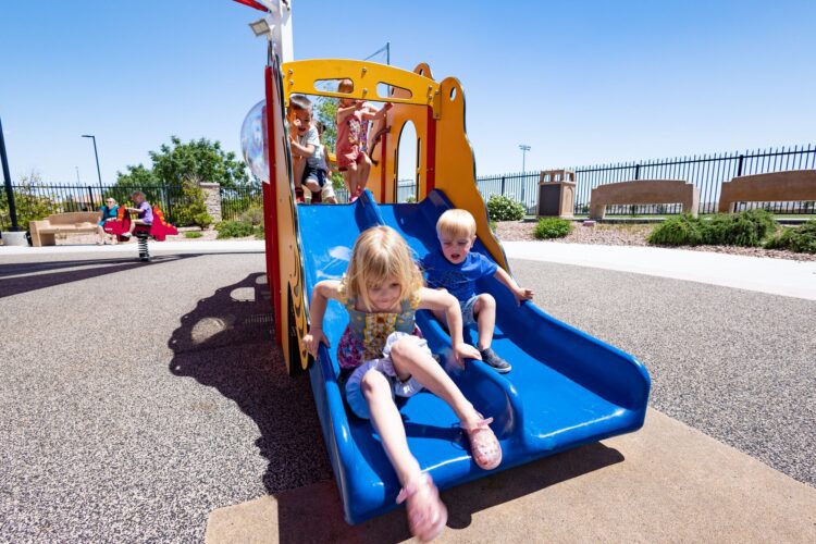 kids on a slide at Alyn Beck Memorial Park in Las Vegas, NV
