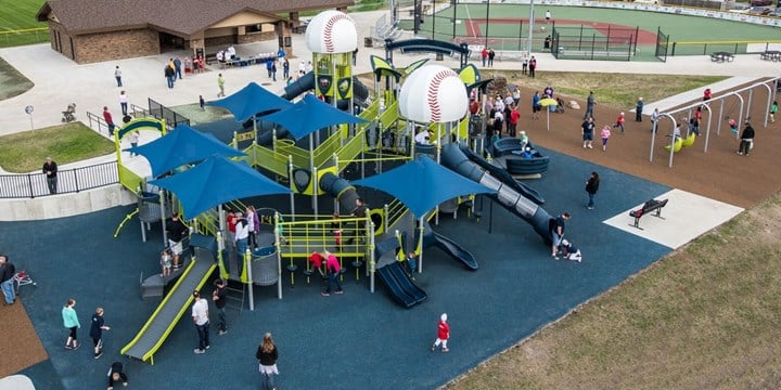 baseball themed playground structure with blue sun shades