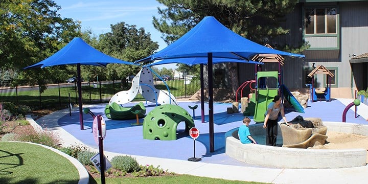 blue sun shades at a small playground