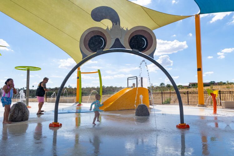 kids playing on the splash pad