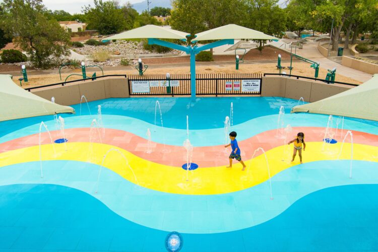Children playing at outdoor splash pad