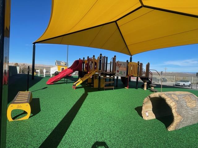 Colorful playground in a cultural color palette at Ojo Encino Day School, Cuba, New Mexico
