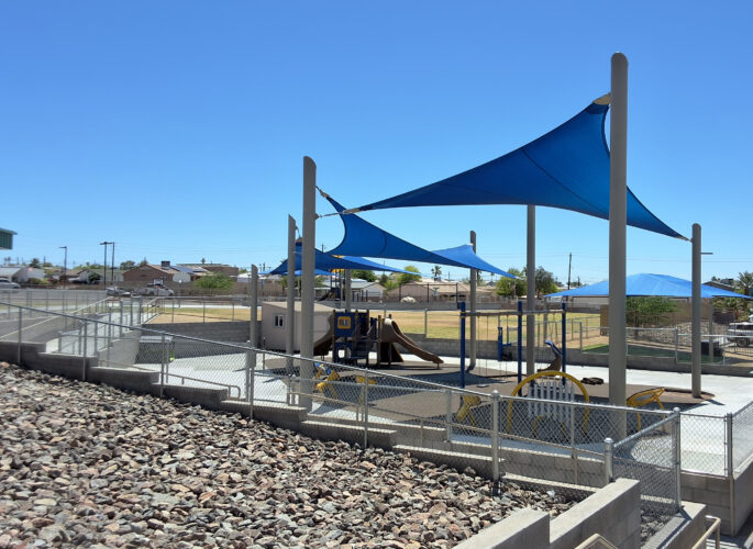Inclusive elementary school playground with multi-age play structures, swings, outdoor musical instruments and rubber safety surfacing in Lake Havasu, AZ