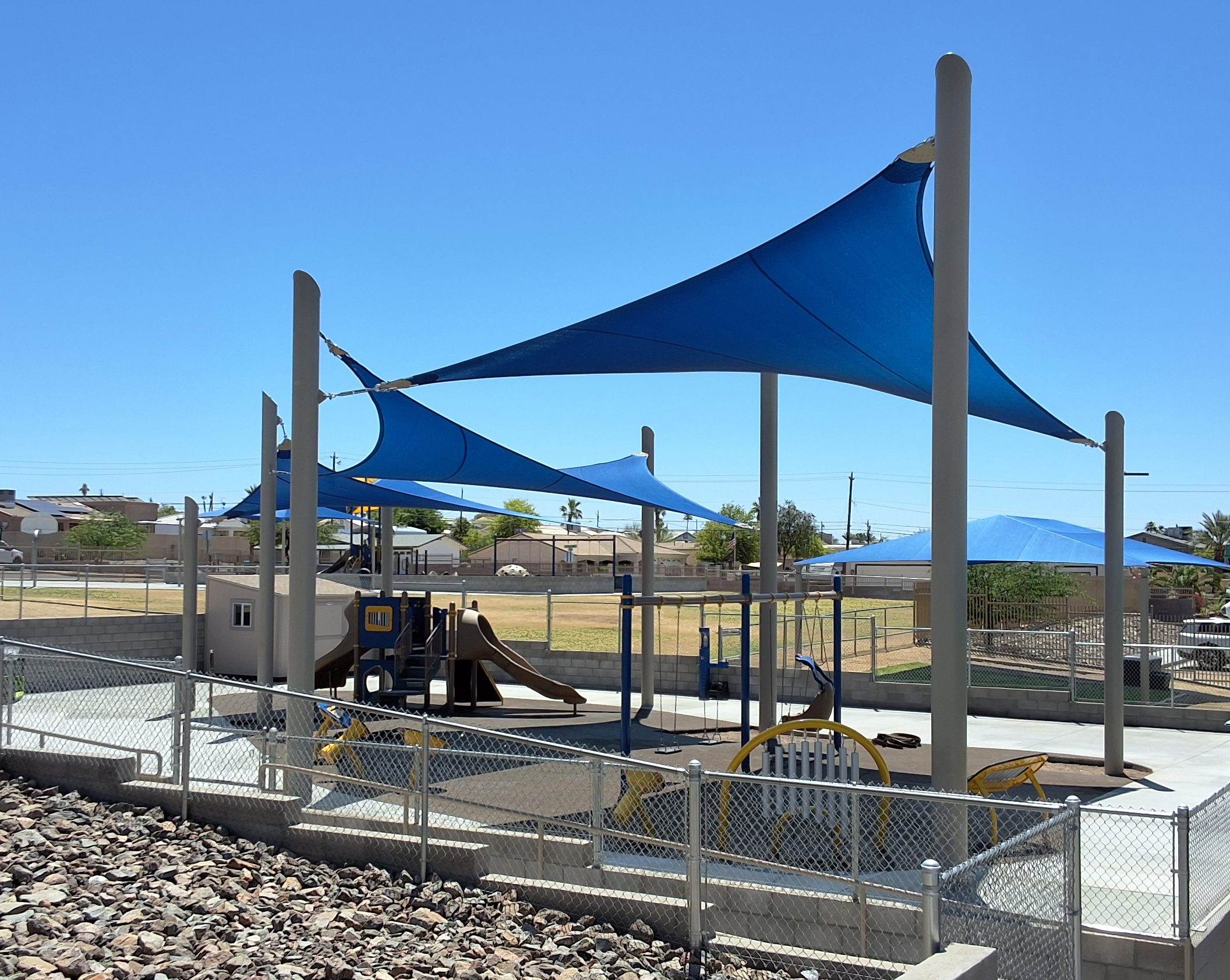 Inclusive elementary school playground with multi-age play structures, swings, outdoor musical instruments and rubber safety surfacing in Lake Havasu, AZ