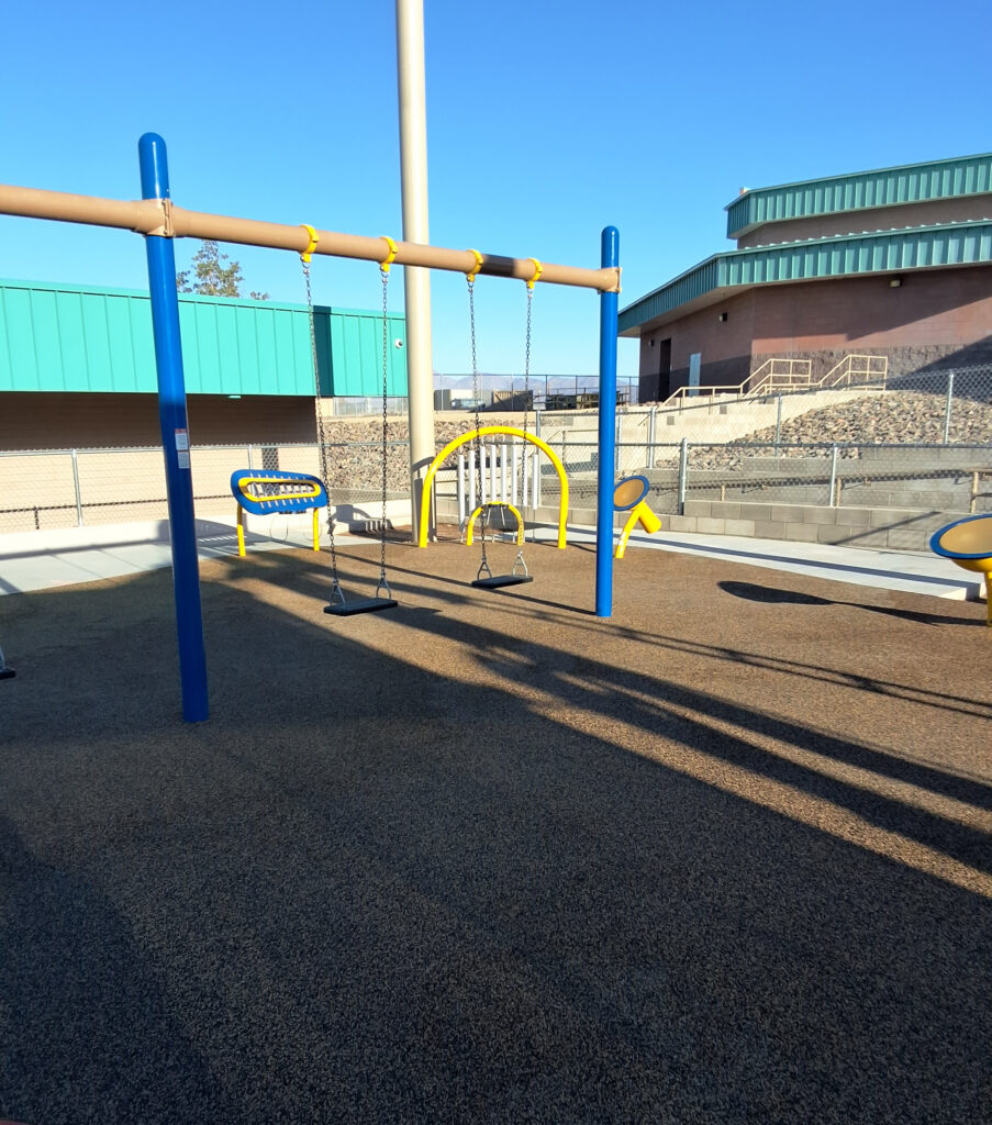 Inclusive elementary school playground with multi-age play structures, swings, outdoor musical instruments and rubber safety surfacing in Lake Havasu, AZ