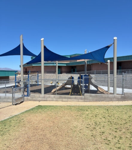 Inclusive elementary school playground with multi-age play structures, swings, outdoor musical instruments and rubber safety surfacing in Lake Havasu, AZ