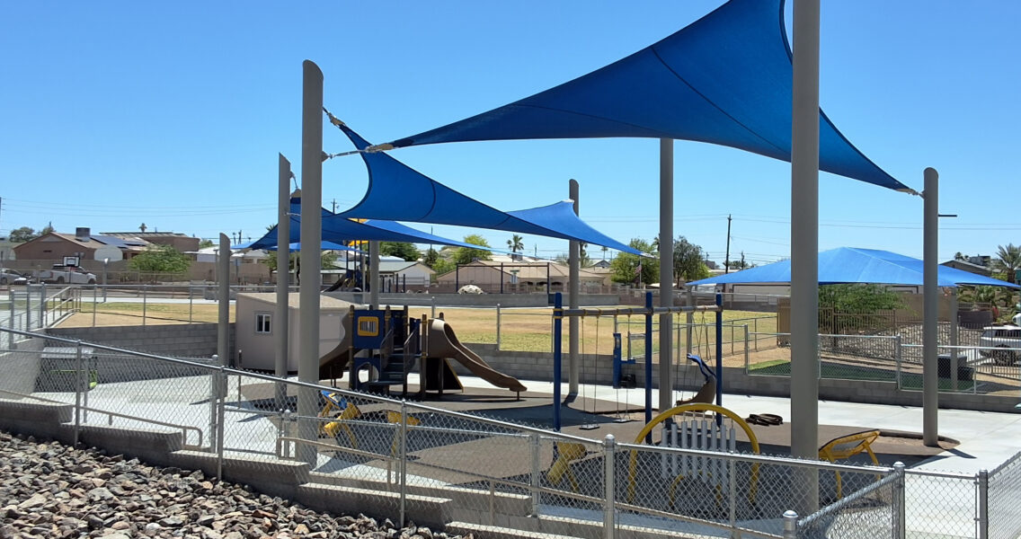 Inclusive elementary school playground with multi-age play structures, swings, outdoor musical instruments and rubber safety surfacing in Lake Havasu, AZ