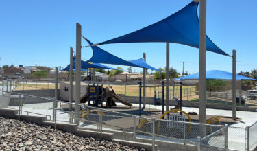 Inclusive elementary school playground with multi-age play structures, swings, outdoor musical instruments and rubber safety surfacing in Lake Havasu, AZ