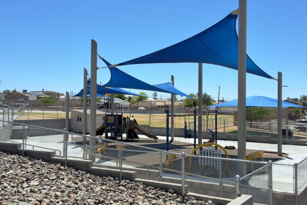 Inclusive elementary school playground with multi-age play structures, swings, outdoor musical instruments and rubber safety surfacing in Lake Havasu, AZ