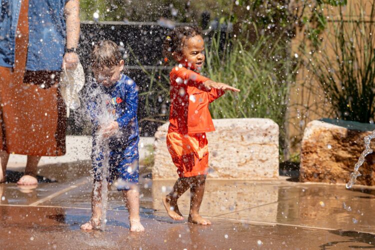 Children play at splash pad at Albuquerque BioPark, in Albuquerque, New Mexico