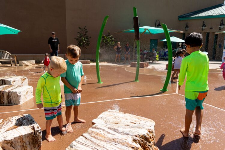 Children play at splash pad at Albuquerque BioPark, in Albuquerque, New Mexico