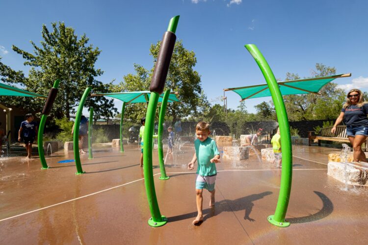 Children play at splash pad at Albuquerque BioPark, Albuquerque, New Mexico