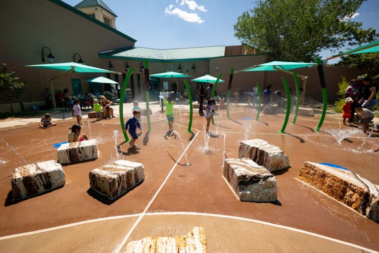 Children play at splash pad at Albuquerque BioPark, in Albuquerque, New Mexico