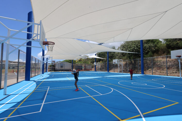 Commercial playground shade structure over sports court at school in Lahaina, Hawaii
