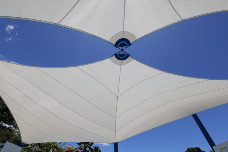 Commercial playground shade structure over sports court at school in Lahaina, Hawaii