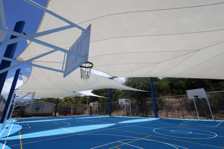 Commercial playground shade structure over sports court at school in Lahaina, Hawaii