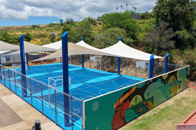 Commercial playground shade structure over sports court at school in Lahaina, Hawaii