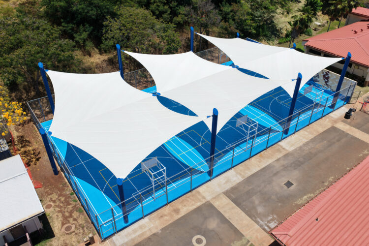 Commercial playground shade structure over sports court at school in Lahaina, Hawaii
