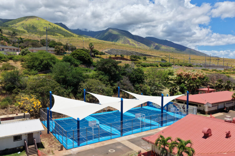 Commercial playground shade structure over sports court at school in Lahaina, Hawaii