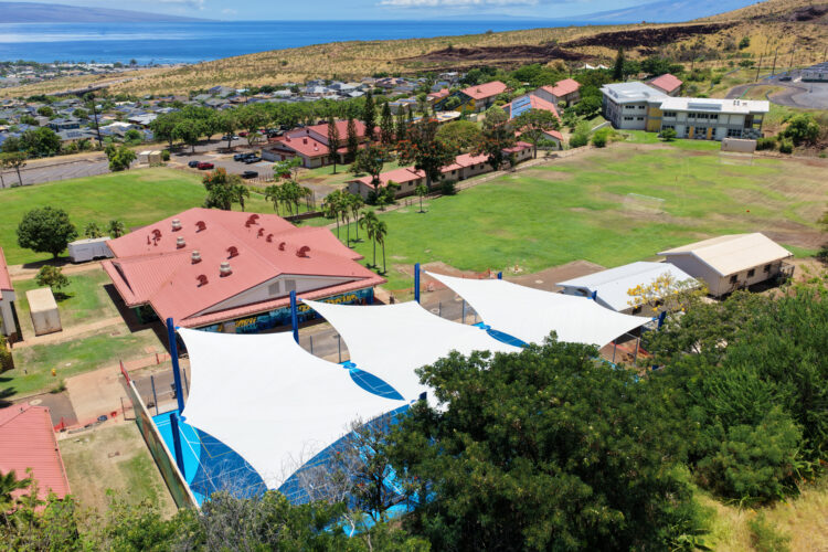 Commercial playground shade structure over sports court at school in Lahaina, Hawaii
