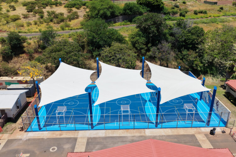 Commercial playground shade structure over sports court at school in Lahaina, Hawaii