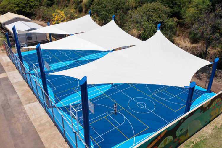 Commercial playground shade structure over sports court at school in Lahaina, Hawaii
