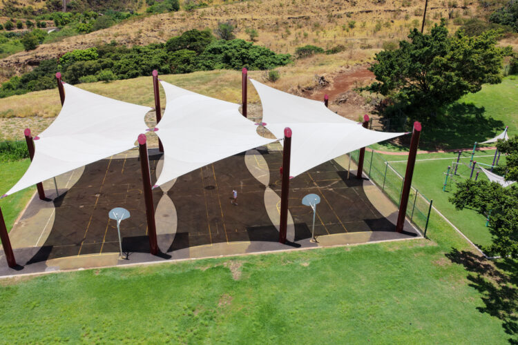 Commercial playground shade structure over sports court at elementary school in Lahaina, Hawaii