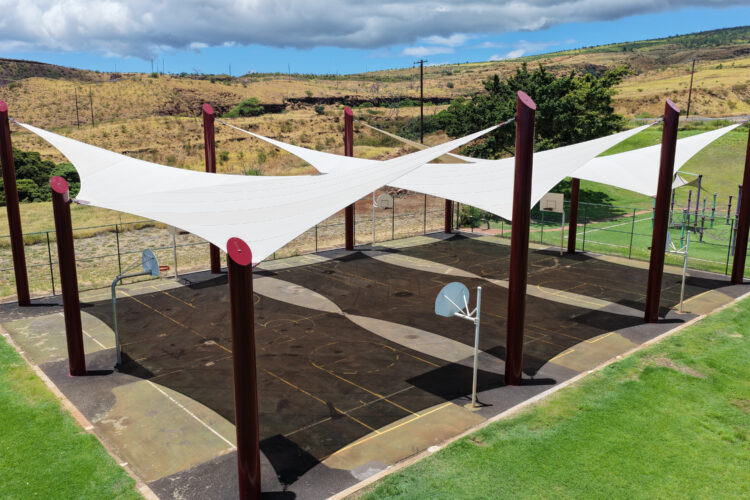 Commercial playground shade structure over sports court at elementary school in Lahaina, Hawaii