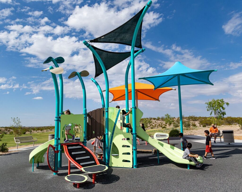Children play at colorful playground at East Mesa Public Recreation Complex, in Las Cruces, New Mexico