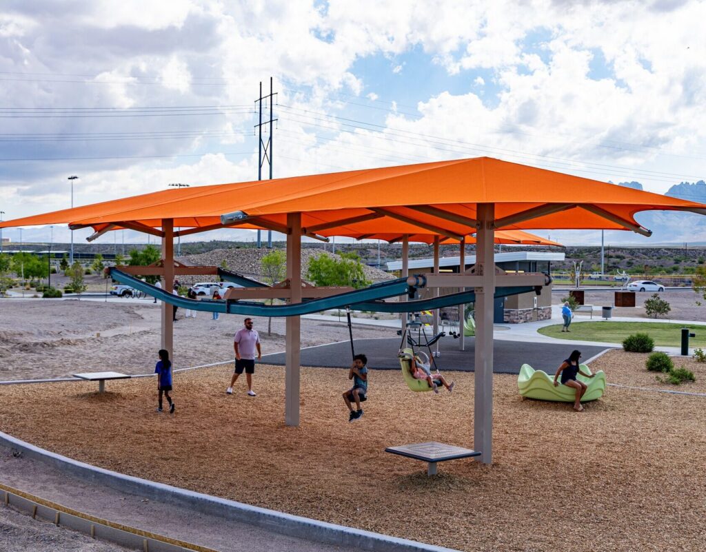 Children ride Zipkrooz zipline at East Mesa Public Recreation Complex, in Las Cruces, New Mexico